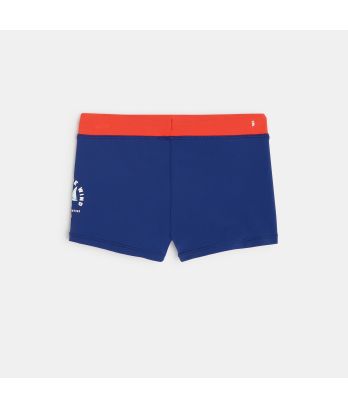 Boy's blue boxer-style swimming trunks with sailboat motif