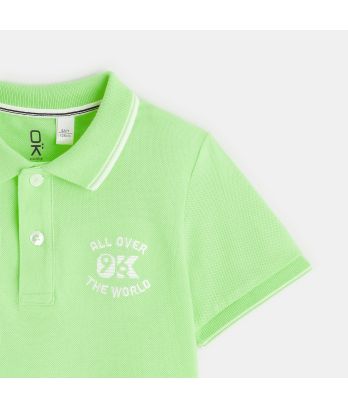 Boy's green piqué fabric polo shirt with short sleeves
