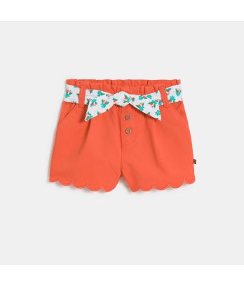 Baby girl's orange printed scalloped shorts with a belt