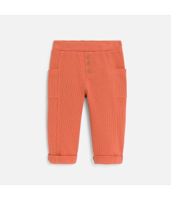 Baby boy's terracotta patterned cotton trousers