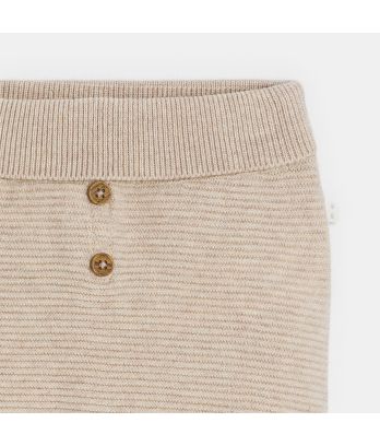 Newborn beige knitted trousers with feet