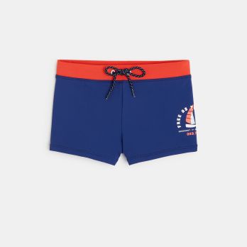 Boy's blue boxer-style swimming trunks with sailboat motif