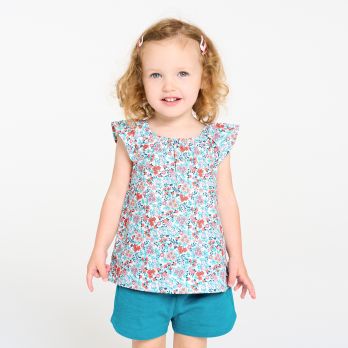 Baby girl's floral blouse and blue shorts