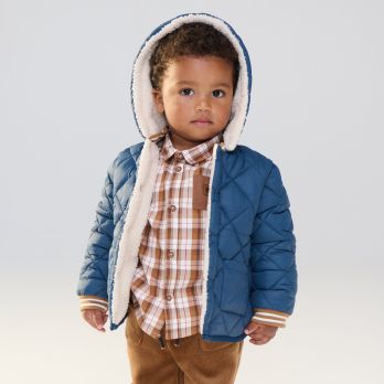 Baby boy's blue reversible quilted coat with faux fur lining