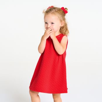 Baby girl's textured red heart pinafore dress