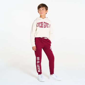 Boy's red joggers with slogan